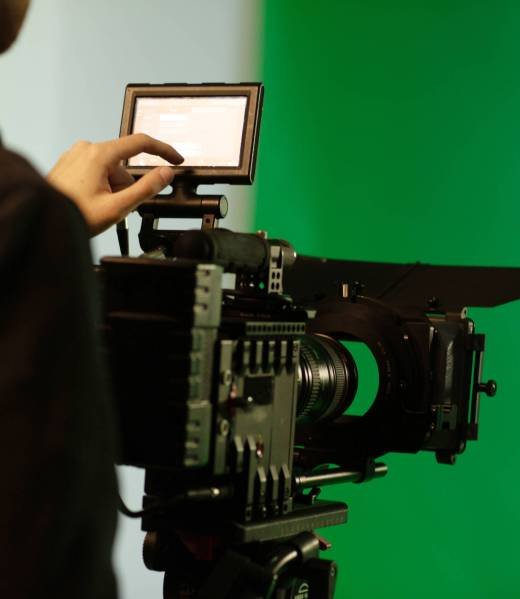 a person touching display while uses camera